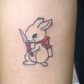 Cartoon rabbit with knife tattoo
