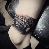 Realism tattoo of classic car done at Tiger and Rose Tattoo, London