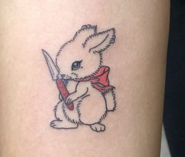 Bunny with knife tattoo