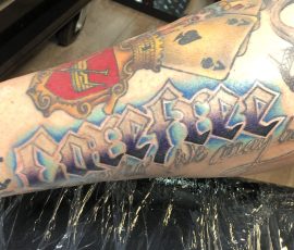 Colourful script tattoo