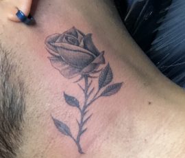 Rose tattoo on neck