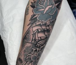 Traditional tattoo of ship and rose