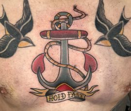 Traditional tattoo of anchor and swallows
