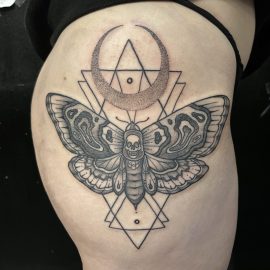 Moth tattoo on hip