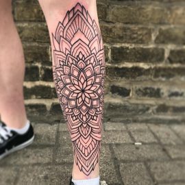 geometric tattoo on shin