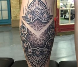 geometric tattoo on calf