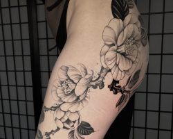Floral & Nature Inspired Tattoos Black and grey floral tattoo on leg done by Anna at Tiger & Rose Tattoo, London