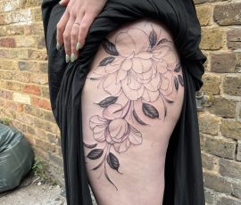 Flowers on hip tattoo