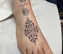 Ornamental foot tattoo