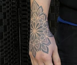 Ornamental hand tattoo