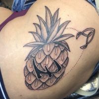 Upside down pineapple tattoo done at Tiger & Rose Tattoo, London