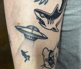 Shark tattoo and ufo tattoo