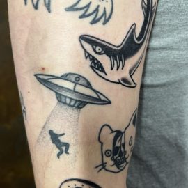 Shark tattoo and ufo tattoo