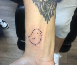 Lined chick tattoo