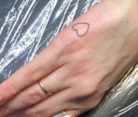 Heart tattoo on side of hand