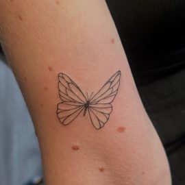Fine line butterfly tattoo done by Peter at Tiger and Rose Tattoo, London