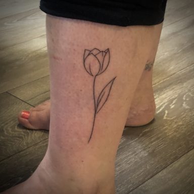 Lined tulip tattoo