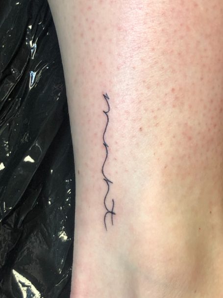 Fine line script tattoo done at Tiger and Rose Tattoo, London