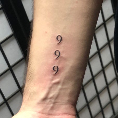 Script tattoo done at Tiger and Rose Tattoo, London