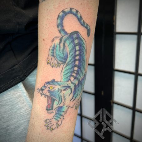 Colourful tiger tattoo done at Tiger and Rose, London