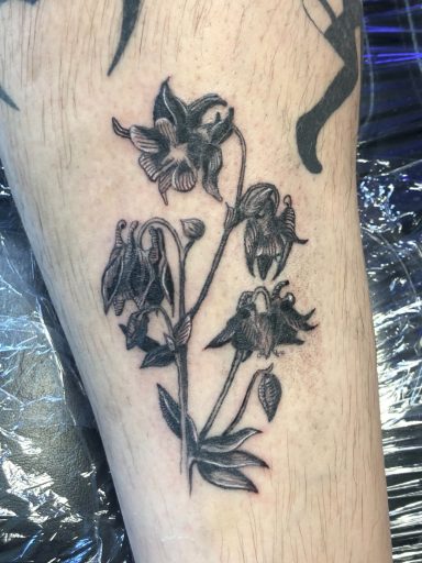 Black and grey flower tattoo done at Tiger and Rose Tattoo, London