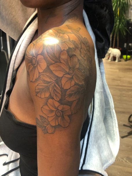 Flower tattoo on dark skin