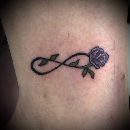 Tiny rose tattoo done at Tiger and Rose Tattoo, London