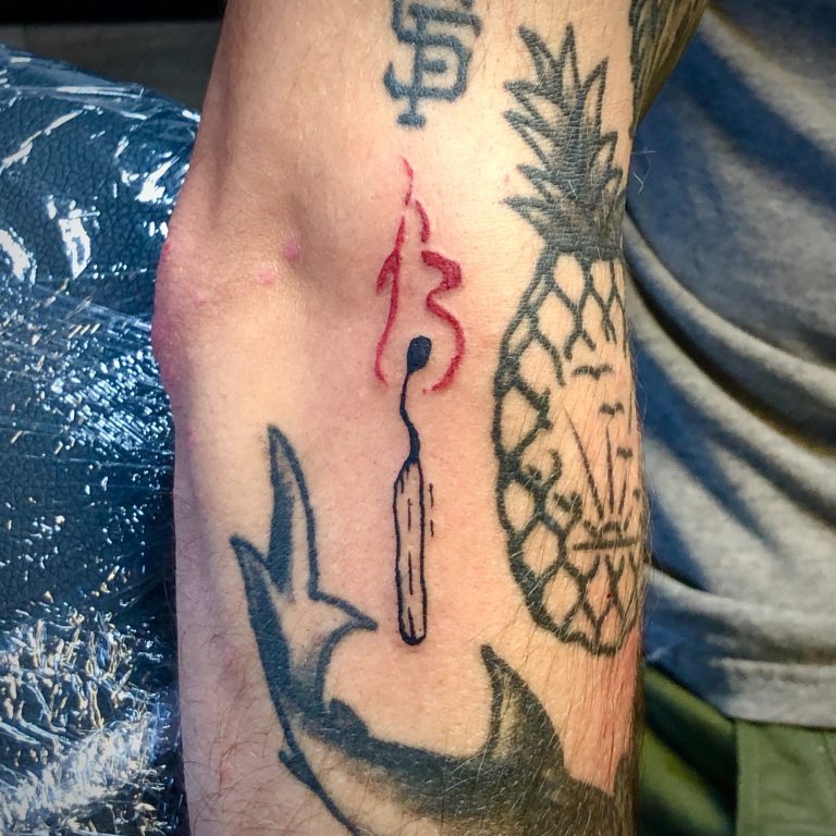 match stick with flame tattoo