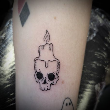 skull with candle tattoo