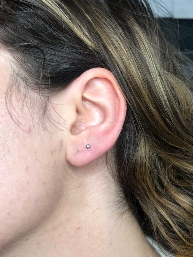 Ear lobe piercing at Tiger and Rose Tattoo