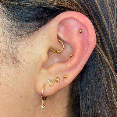 Ear piercing with several pieces of jewellery